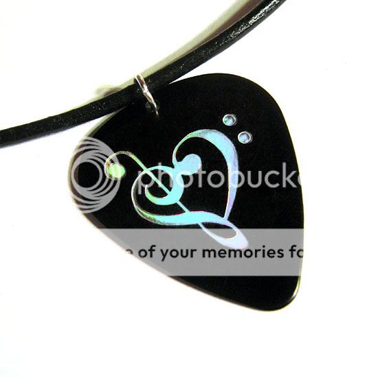 guitar pick that has been hot  foil stamped with a clef